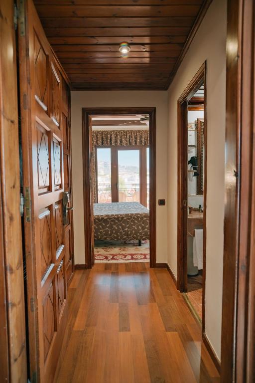 a hallway with a room with a bed and a window at Rigat Park & Spa Hotel - Adults Recommended in Lloret de Mar