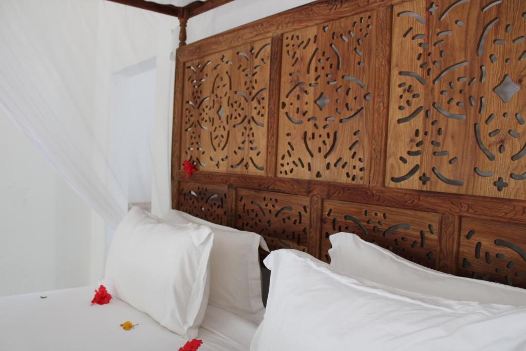 Postel nebo postele na pokoji v ubytování Kivuli Beach Resort Paje