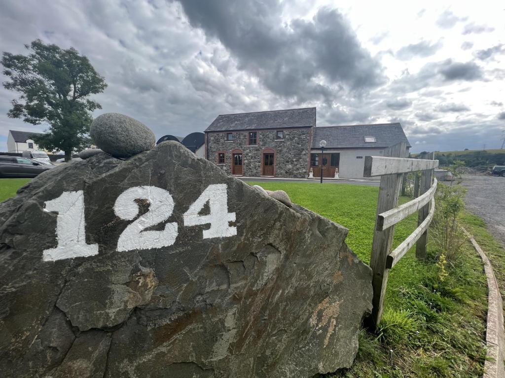 a rock with the number on it in front of a house at Avoca Lodge in Lisburn