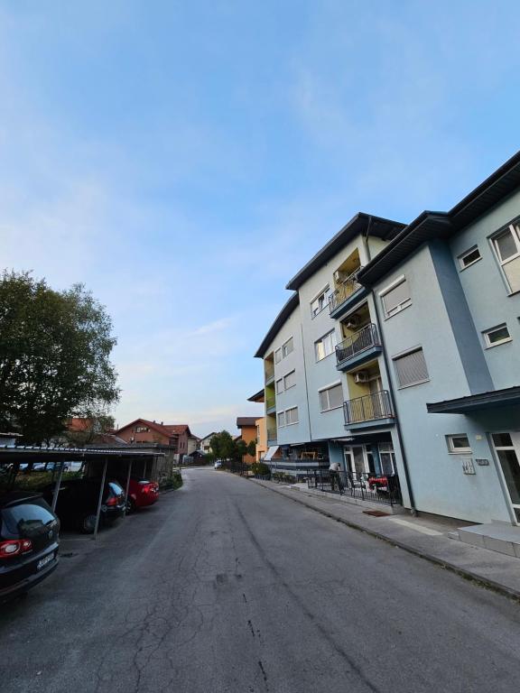 an empty street in a city with buildings at Apartman Sany in Bihać