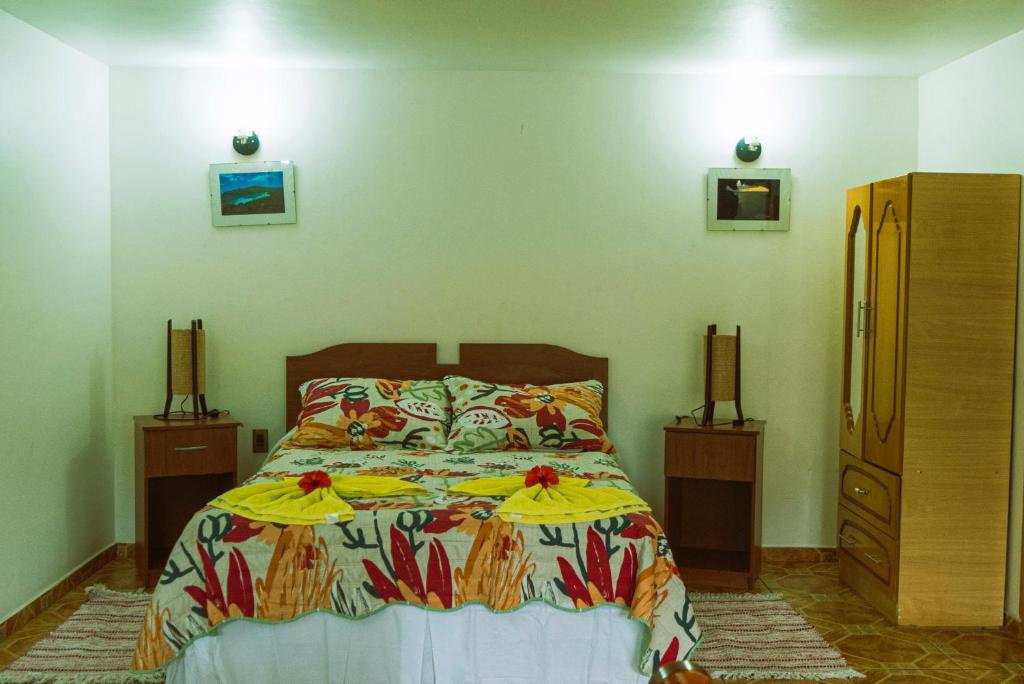 Postel nebo postele na pokoji v ubytování Hostal y Cabañas Aorangi