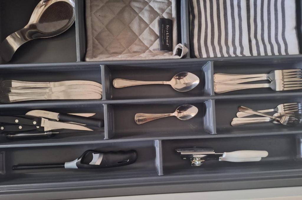 a drawer filled with lots of utensils at Morning Star Aruba in Oranjestad