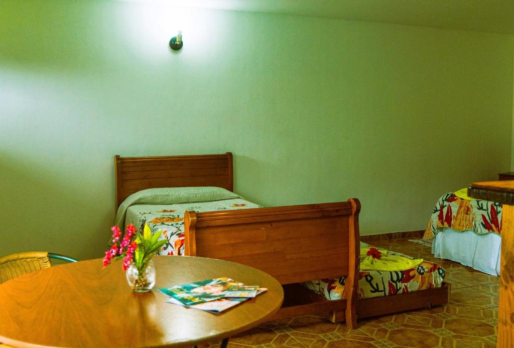 Postel nebo postele na pokoji v ubytování Hostal y Cabañas Aorangi