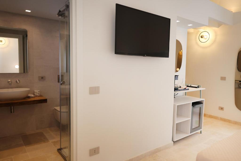 TV a/nebo společenská místnost v ubytování Suites Dimora Garibaldi