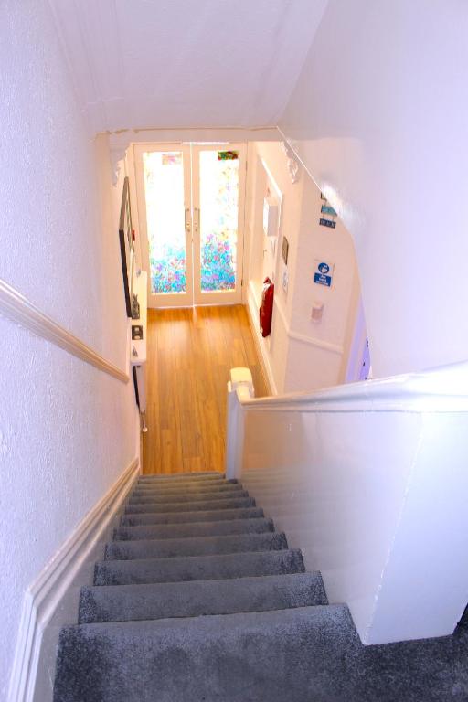 a staircase leading up to a room with a window at The Regency Hotel in Blackpool
