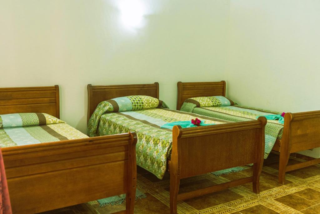 Postel nebo postele na pokoji v ubytování Hostal y Cabañas Aorangi