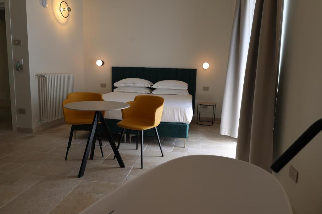 Postel nebo postele na pokoji v ubytování Suites Dimora Garibaldi