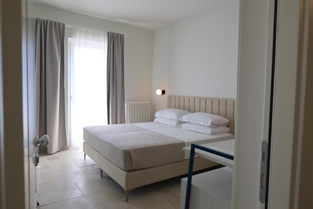 Postel nebo postele na pokoji v ubytování Suites Dimora Garibaldi