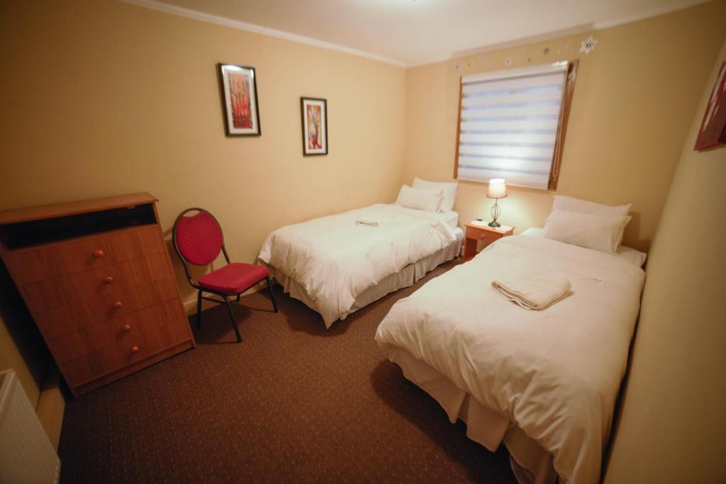 Postel nebo postele na pokoji v ubytování Departamentos Cordillera