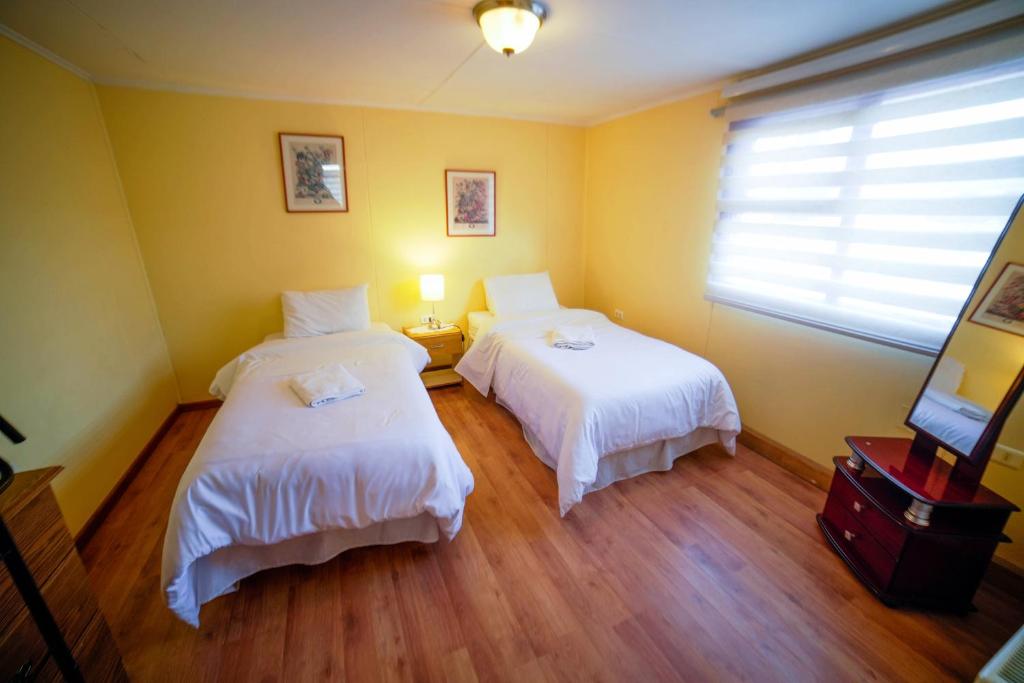 Postel nebo postele na pokoji v ubytování Departamentos Cordillera