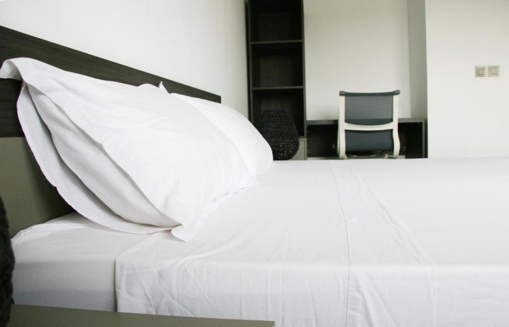 Voodi või voodid majutusasutuse DAKAR by DAYS-DBD007-Appartement AMELIE 3 chambres 4 pax toas