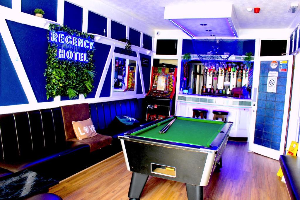 a billiard room with a pool table and a bar at The Regency Hotel in Blackpool