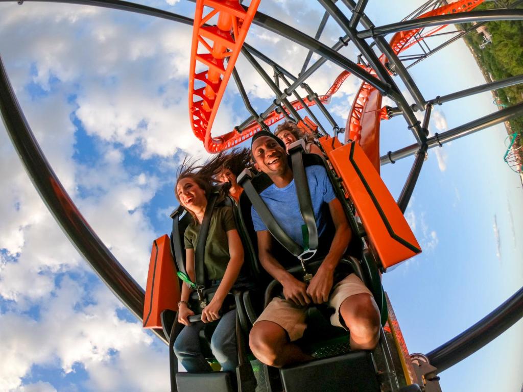 a group of people riding on a roller coaster at Holiday Inn Express Hotel Clearwater East - ICOT Center, an IHG Hotel in Pinellas Park