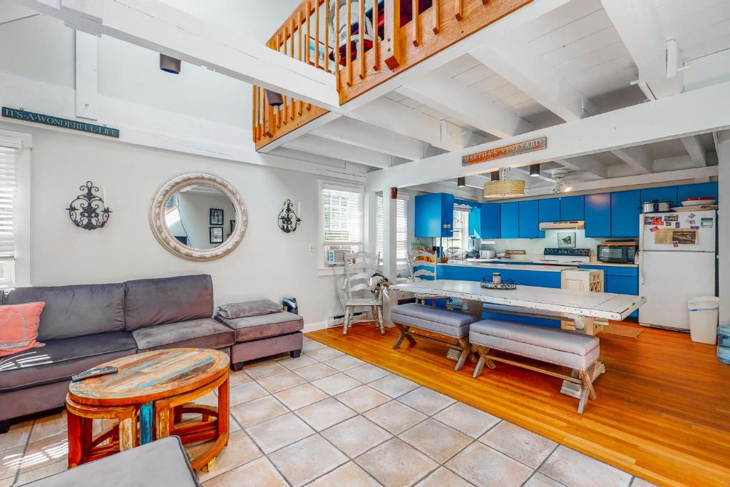 a living room with a couch and a table at Martha's Hideaway in Edgartown