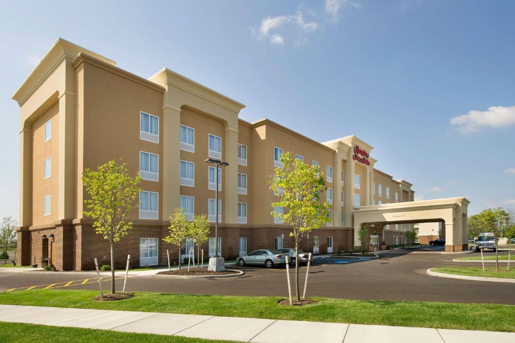 a rendering of a hotel with a parking lot at Hampton Inn & Suites - Buffalo Airport in Cheektowaga