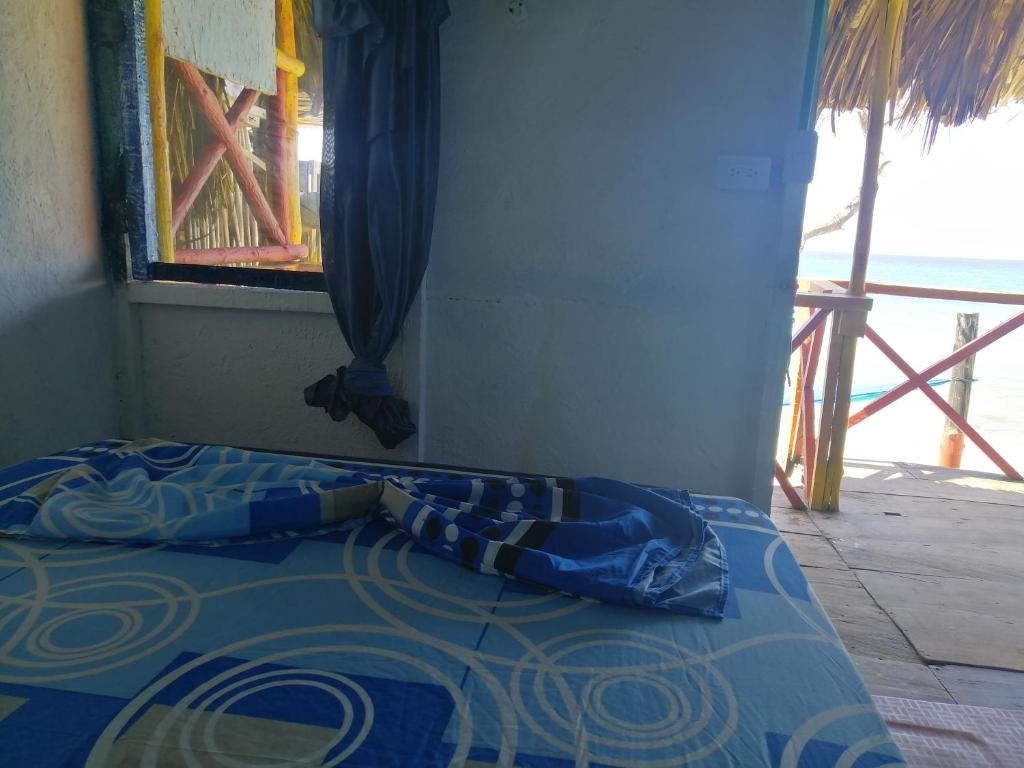 Postel nebo postele na pokoji v ubytování Playa Tortuga Cabaña