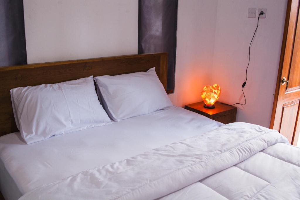 Postel nebo postele na pokoji v ubytování Timbul Homestay
