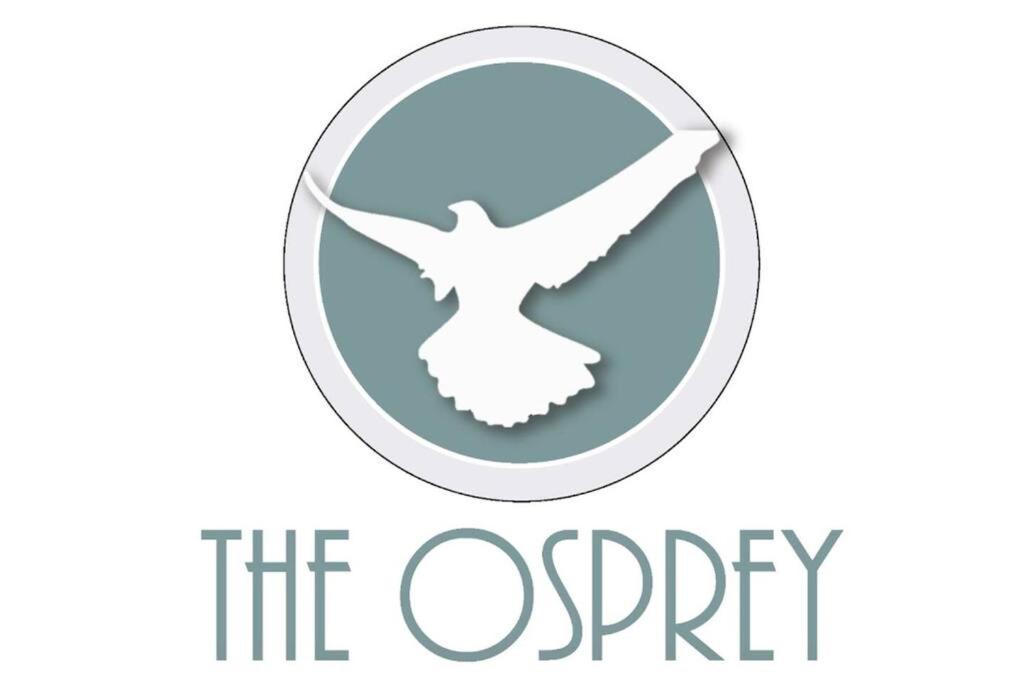a logo for the osprey seafood restaurant at Osprey -Luxury 3BDR Beach House in Orange Beach
