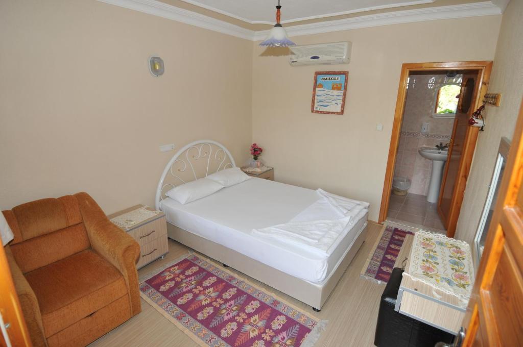 Postel nebo postele na pokoji v ubytování Hotel Pamukkale