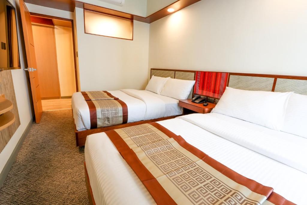 Postel nebo postele na pokoji v ubytování Sotogrande Hotel Baguio