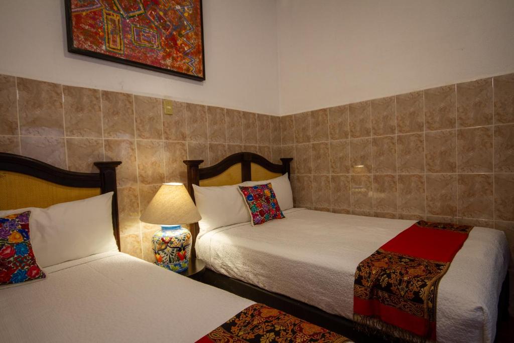 Postel nebo postele na pokoji v ubytování Hotel del Sol