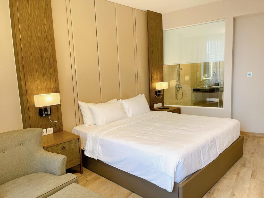 Giường trong phòng chung tại Panorama Nha Trang Central Condotel