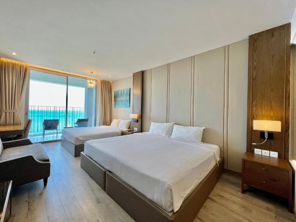 Giường trong phòng chung tại Panorama Nha Trang Central Condotel