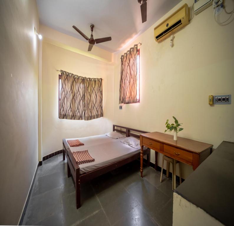 Ένα ή περισσότερα κρεβάτια σε δωμάτιο στο Sacar Guest House