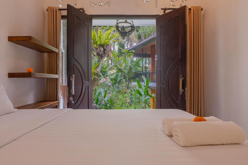 Postel nebo postele na pokoji v ubytování Shankara Accomodation Ubud