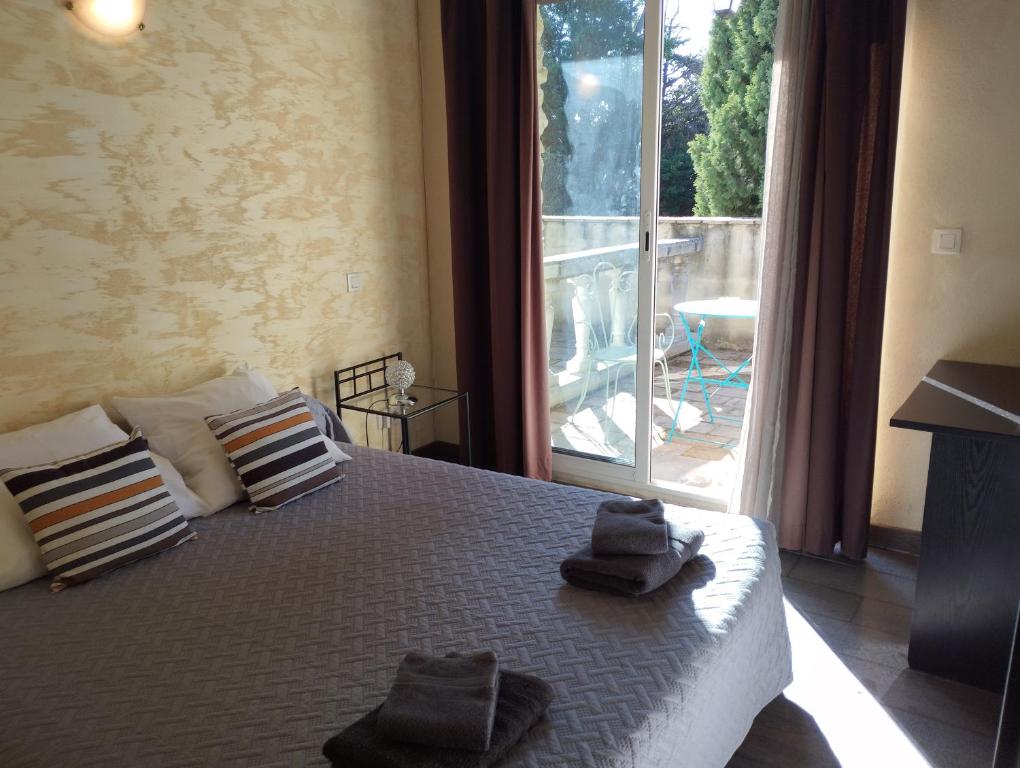 Postel nebo postele na pokoji v ubytování Logis Hotel Restaurant L'Esquielle