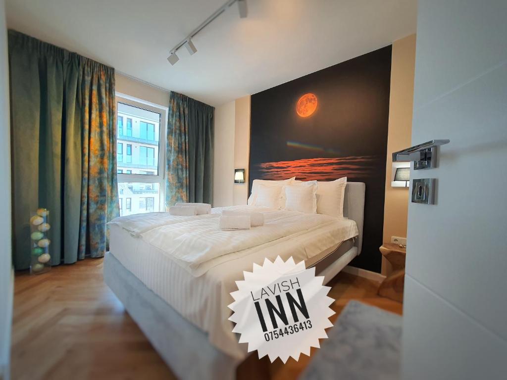 Ліжко або ліжка в номері Lavish Inn Apartment
