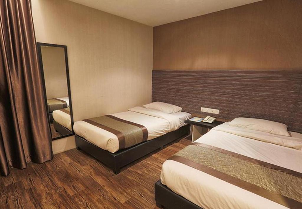 Postel nebo postele na pokoji v ubytování Hotel Austin Paradise