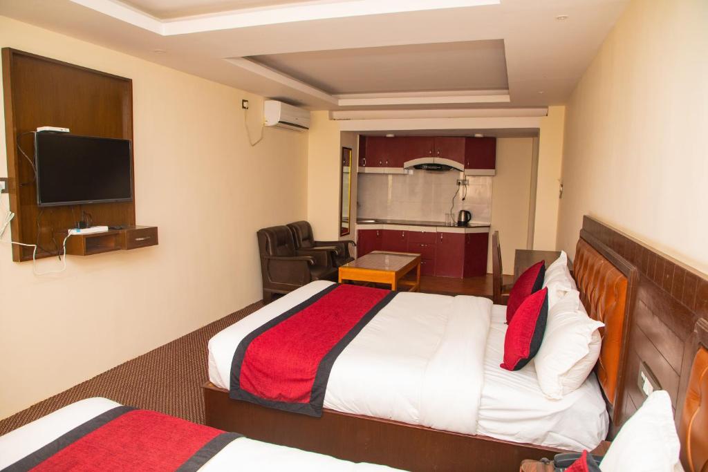 Postel nebo postele na pokoji v ubytování Hotel de Universal