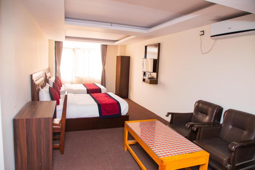 Postel nebo postele na pokoji v ubytování Hotel de Universal