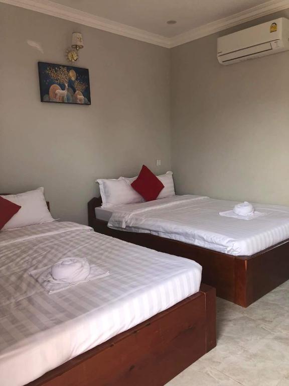 Postel nebo postele na pokoji v ubytování Kro Nhep Guesthouse