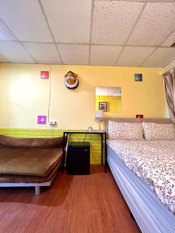 Postel nebo postele na pokoji v ubytování Taipei Triple Tiger Inn