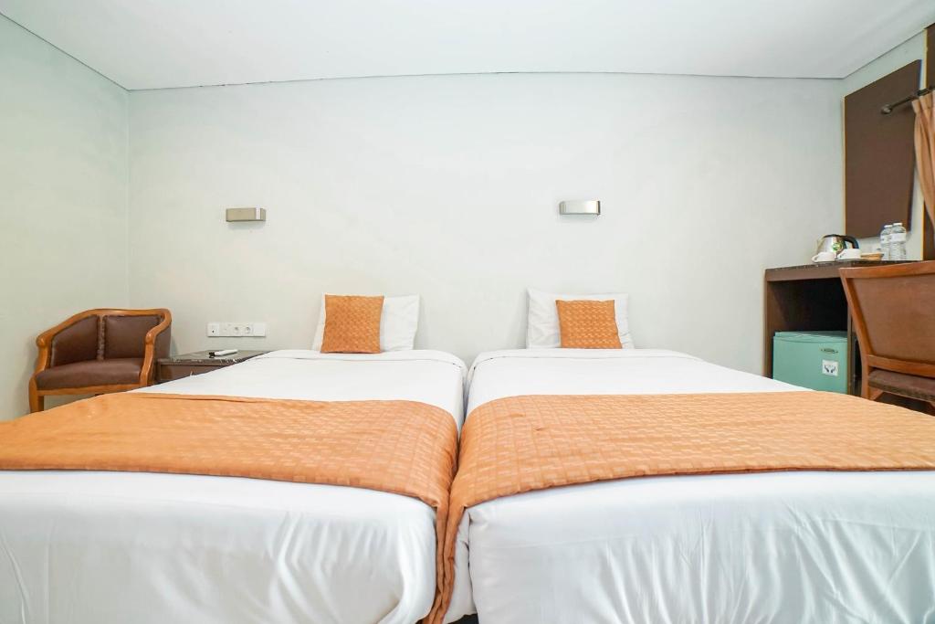 Postel nebo postele na pokoji v ubytování Hotel Kalisma by Alia