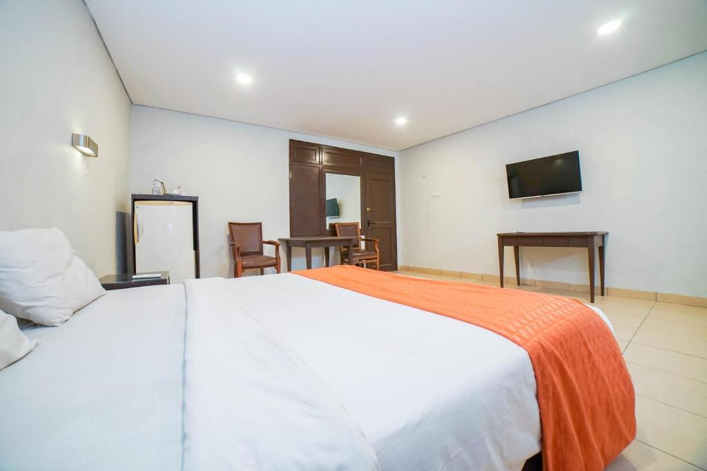 Postel nebo postele na pokoji v ubytování Hotel Kalisma by Alia