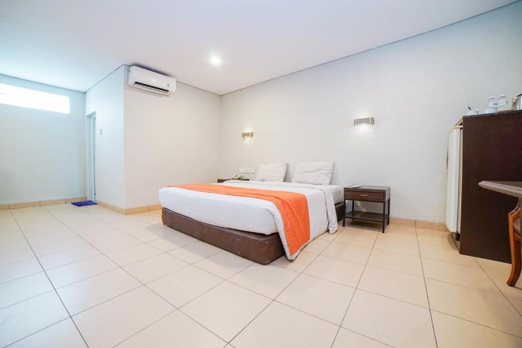 Postel nebo postele na pokoji v ubytování Hotel Kalisma by Alia