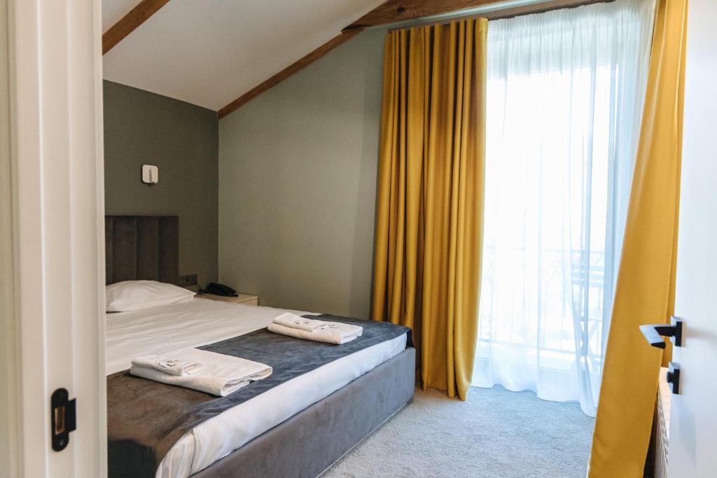 Postel nebo postele na pokoji v ubytování Ariam Boutique Hotel
