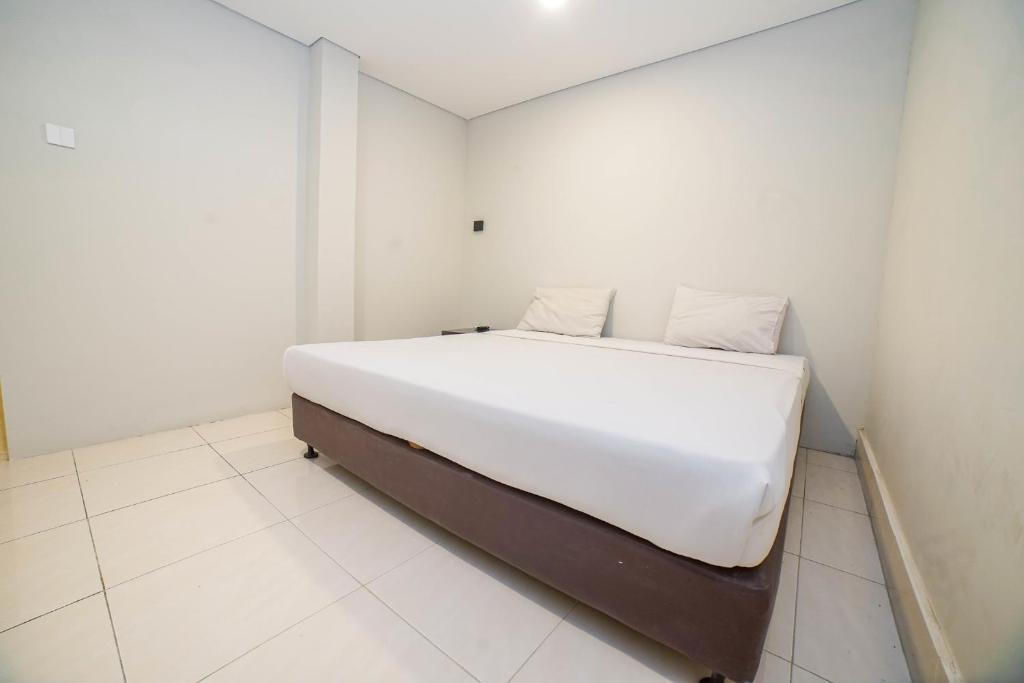 Postel nebo postele na pokoji v ubytování Hotel Kalisma by Alia