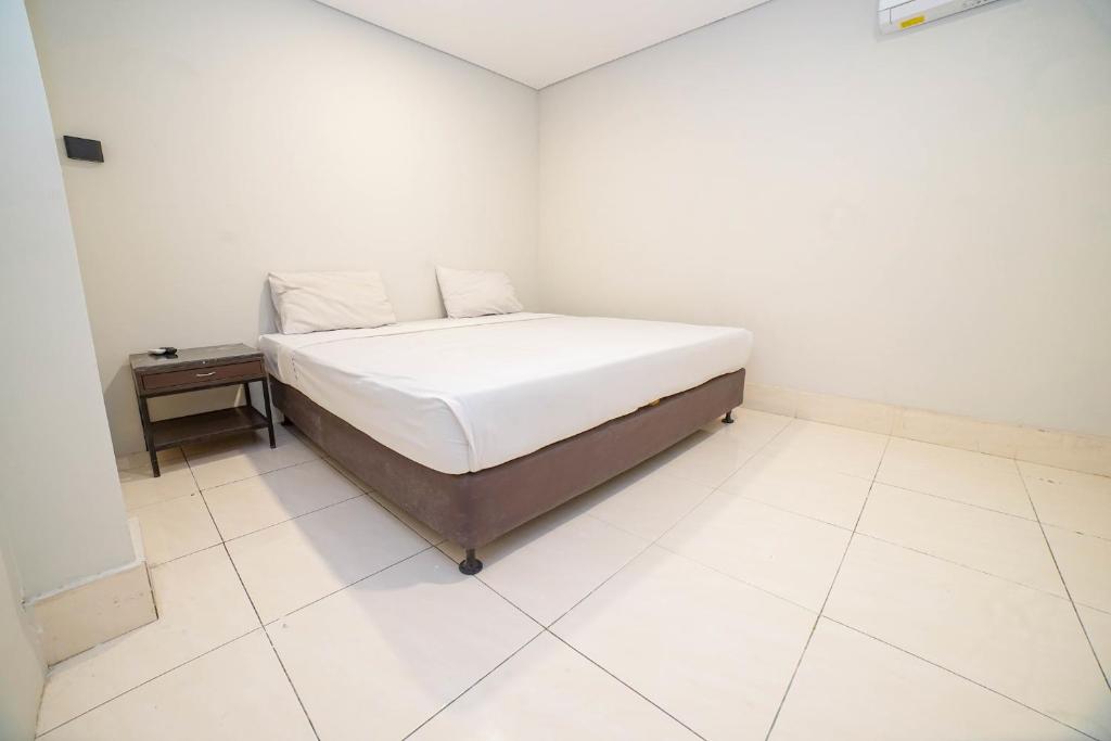 Postel nebo postele na pokoji v ubytování Hotel Kalisma by Alia
