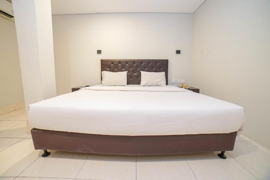 Postel nebo postele na pokoji v ubytování Hotel Kalisma by Alia