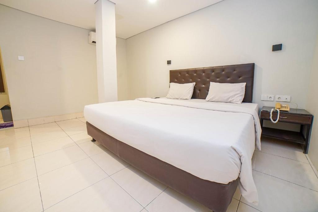Postel nebo postele na pokoji v ubytování Hotel Kalisma by Alia