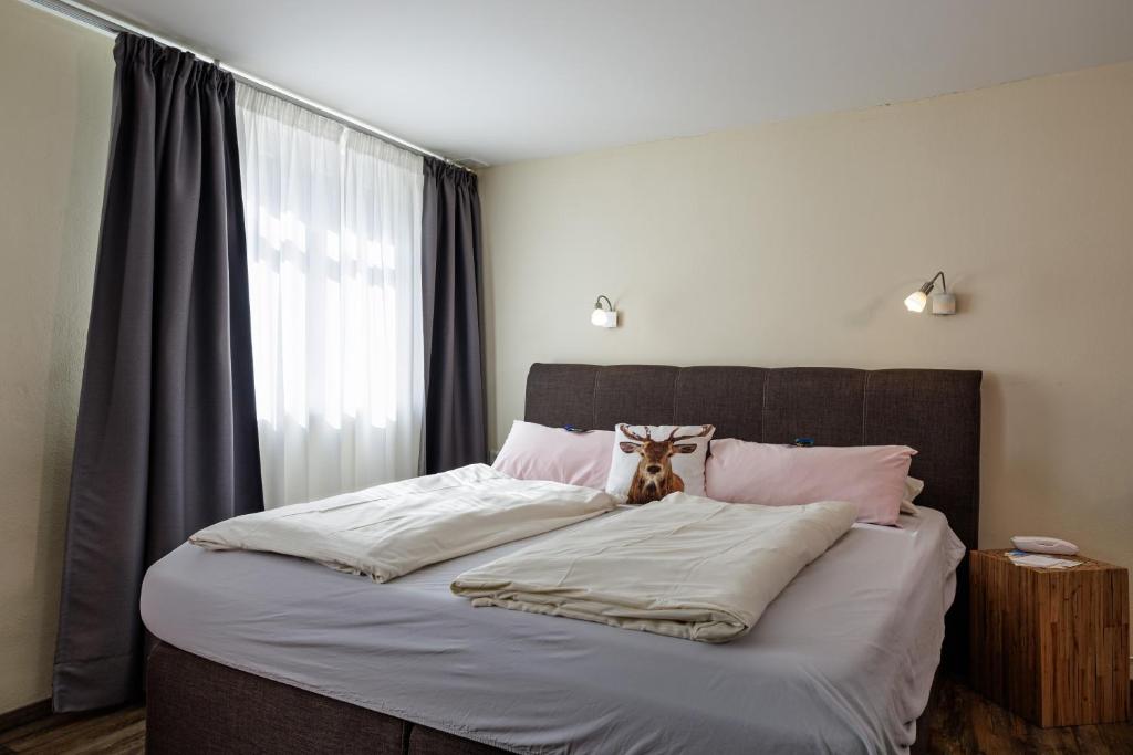 Postel nebo postele na pokoji v ubytování Flair Hotel Hopfengarten