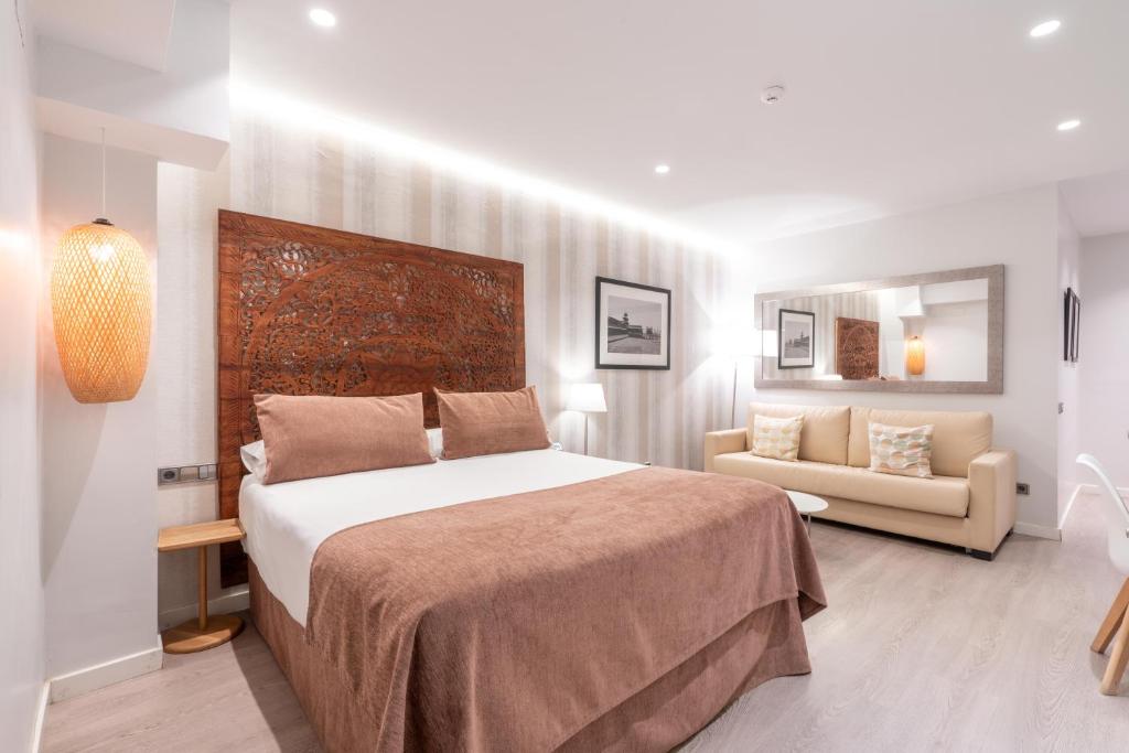 Posteľ alebo postele v izbe v ubytovaní Serennia Fira Gran Via Exclusive Rooms