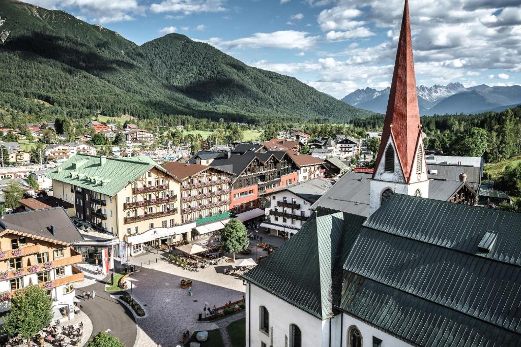 an aerial view of a town with a church at Post Seefeld Hotel & SPA in Seefeld in Tirol