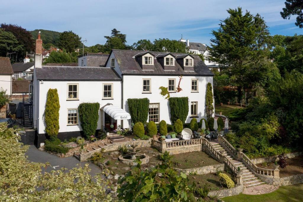 an aerial view of a white house with a garden at Private Use-Mount Pleasant Hotel 17 BR (sleeps32) in Sidmouth