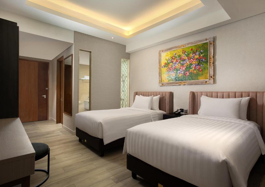 Ένα ή περισσότερα κρεβάτια σε δωμάτιο στο Trembesi Hotel
