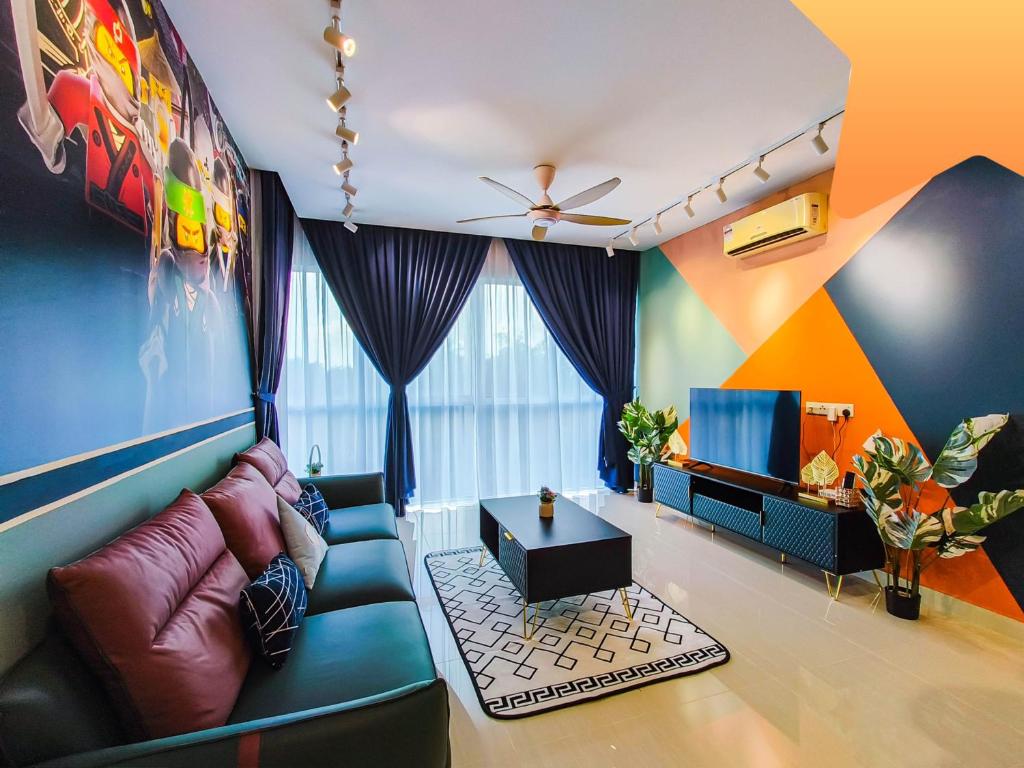 a living room with a couch and a tv at Medini Signature Ninjago Suites in Nusajaya